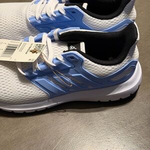 Adidas Ultimashow running shoes in white with light blue accents